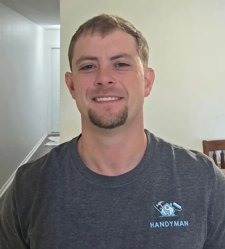 Daniel Cobb, owner of Collin County Handyman Company, performing home repairs in Wylie TX